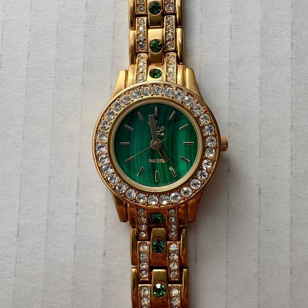 Colleen Lopez Gold Tone Watch With Emerald Color Accents